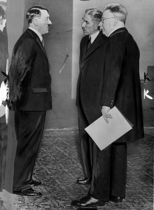 Franz von Papen, Hugenburg, and Adolf Hitler side-by-side